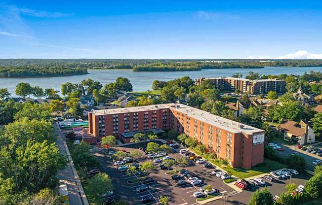 A large building with a parking lot in front of it.