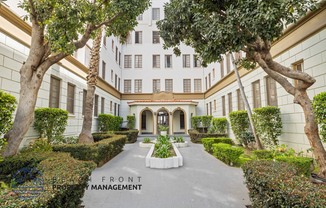 A building with a sign that says Front Management.