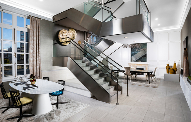 Modern touches mix with historical elements seamlessly at Modera Sedici, like this steel and glass staircase in the leasing area