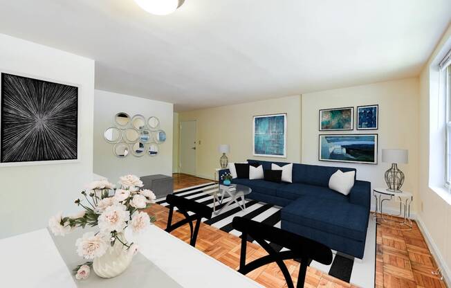 dining area with table, chairs, hardwood flooring and view of living area at shipley park apartments in washington dc