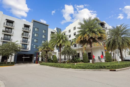 Shot of our building and entrance to parking garage with automatic gates at Bay Village 1 in Palmetto Bay, FL