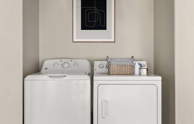 a washer and dryer in a laundry room at Arcadia Apartments, Centennial