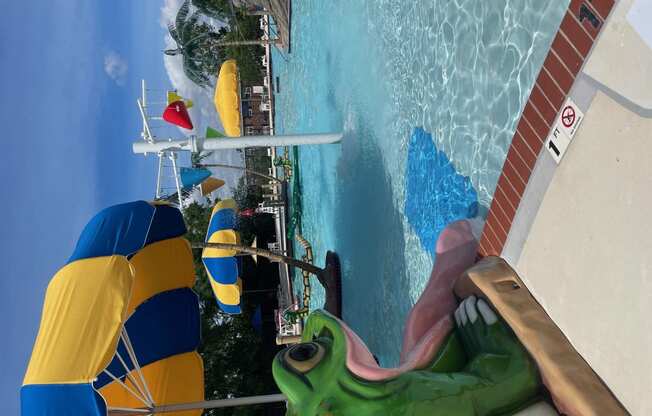 a view of a pool from a water slide at a water park