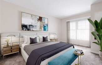 a bedroom with a large painting on the wall and a bed with a blue blanket at West 130, West Hempstead, NY