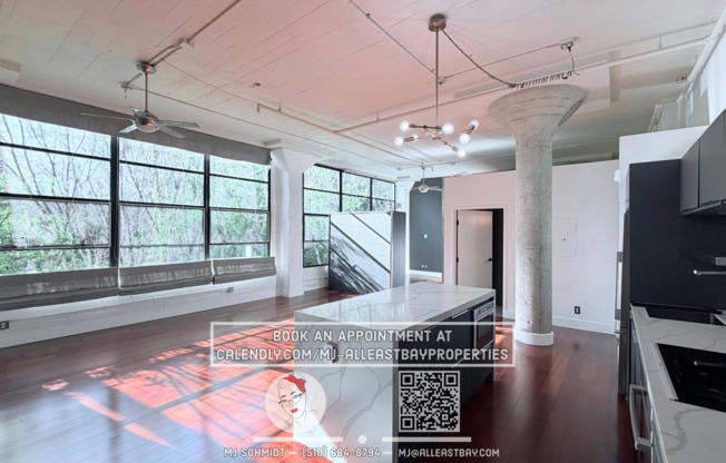 Sunny loft with in unit gym, heated floors in bathroom, contemporary kitchen, and includes water/garbage/1parking!