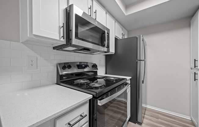 a kitchen with a stove and a refrigerator