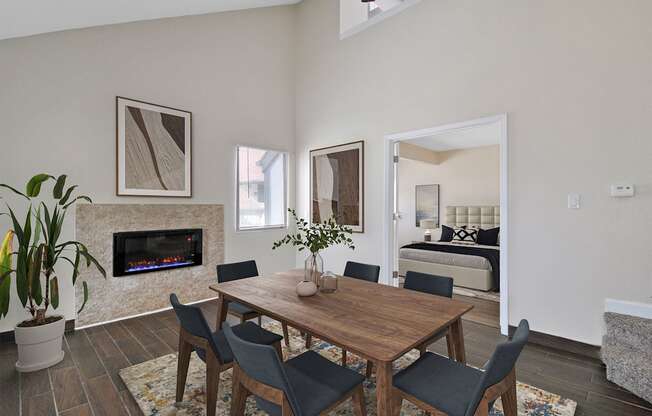 a dining room with a table and chairs and a fireplace