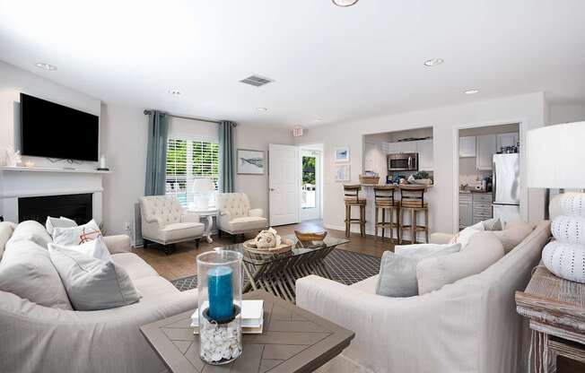 A living room with a grey couch and a coffee table.