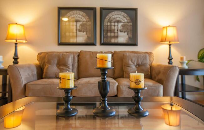 a living room next to a glass of orange juice