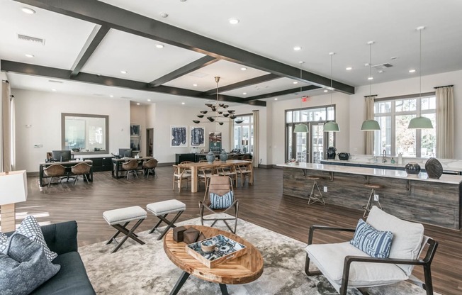 a living room with furniture and a bar and a dining room at Village at Westland Cove Apartments, Knoxville