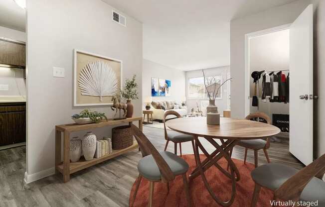 a dining room with a table and a living room