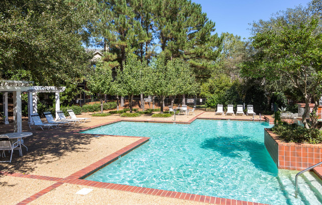 Swimming pool with sun deck and shaded pavilion at Regency Gates in Mobile, AL