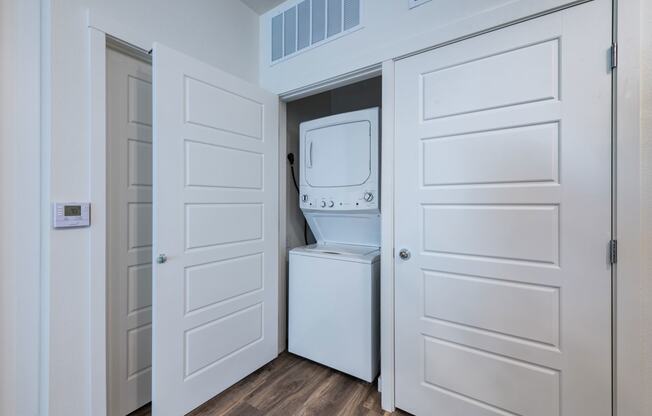 a room with a washer and dryer in a closet