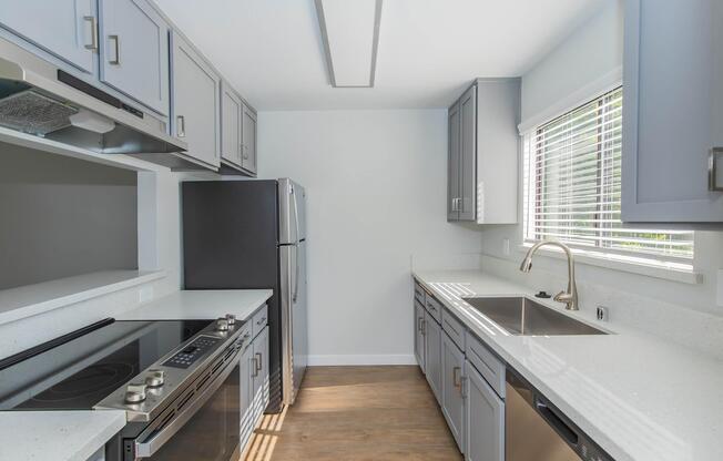 a kitchen with a sink and a window