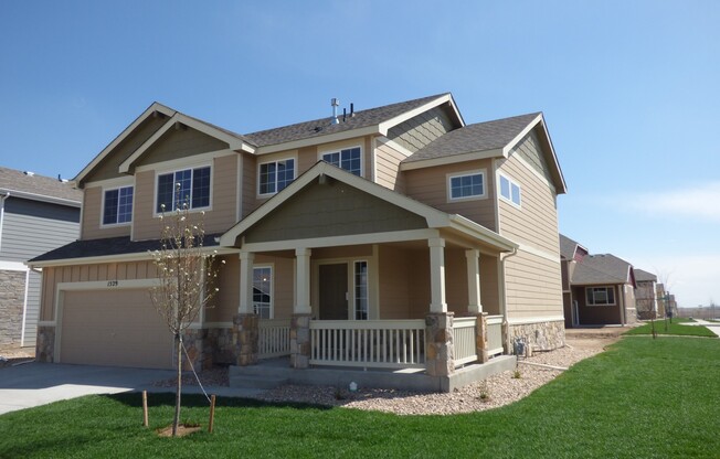 Lovely 2 Story Home in Windsor's Raindance Community! Corner Lot!