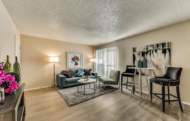 a living room filled with furniture and a table