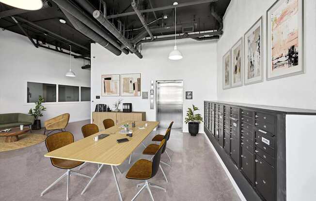 A conference room with a long table and chairs.