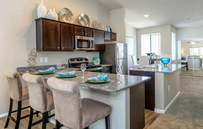 Kitchen wide view with cabinets and appliances at The Cantera by Picerne, Nevada, 89139