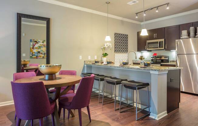 Dining area and breakfast bar in kitchen apartment - Greenwood Reserve | Kansas City Apartments