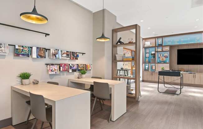 a dining area with tables and chairs and a tv