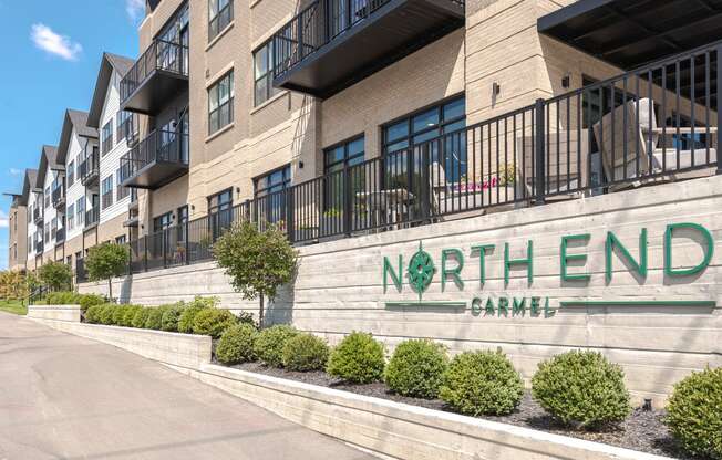 a large building with a sign that reads north end apartment complex