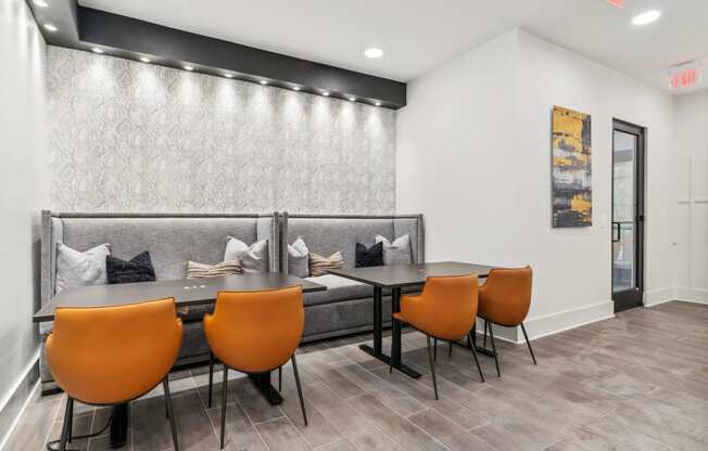 a dining room with a table and chairs