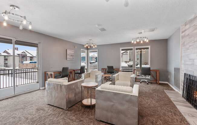 a living room with couches and chairs and a balcony at Eastwood Crossings, Kansas City, MO