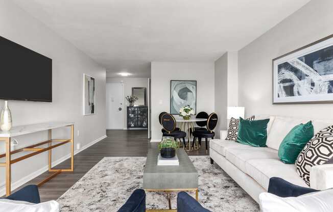 a living room with grey walls and a white couch