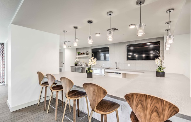 Clubroom Lounge and Dining Area with large kitchen with island and stainless steel appliances at arte apartments