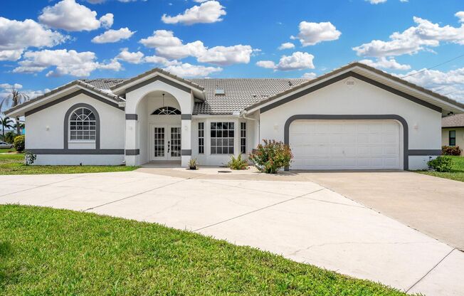 Large 3 Bedroom 3 Bathroom Home Right On The Canal In SW Cape Coral!!!
