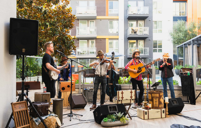 a group of musicians playing instruments on a stage