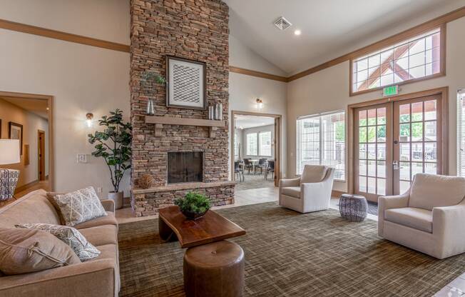 a living room with a stone fireplace and a couch