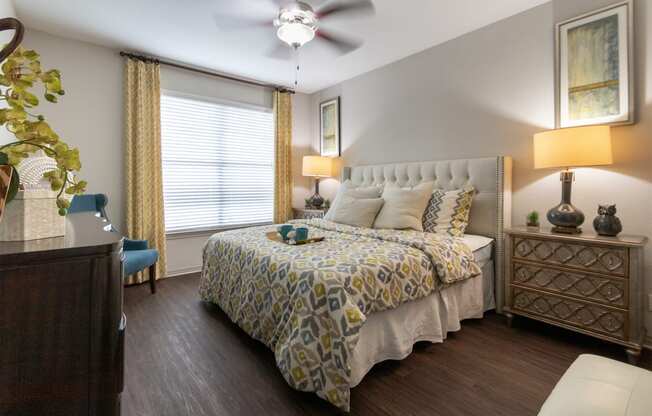 This is a photo of the bedroom of the 826 square foot 1 bedroom apartment at The Brownstones Townhome Apartments in Dallas, TX.