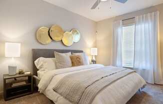 a bedroom with a bed and a ceiling fan at Volare at the Woodlands, The Woodlands, 77384