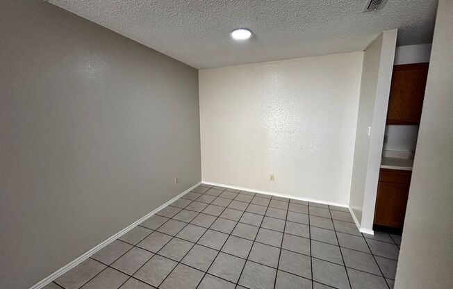 Open Concept, Wood burning fireplace with Ceramic Flooring