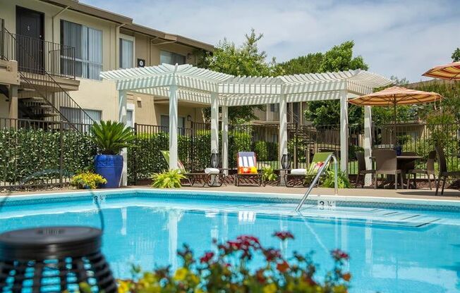 Relax under our trellis next to the pool.