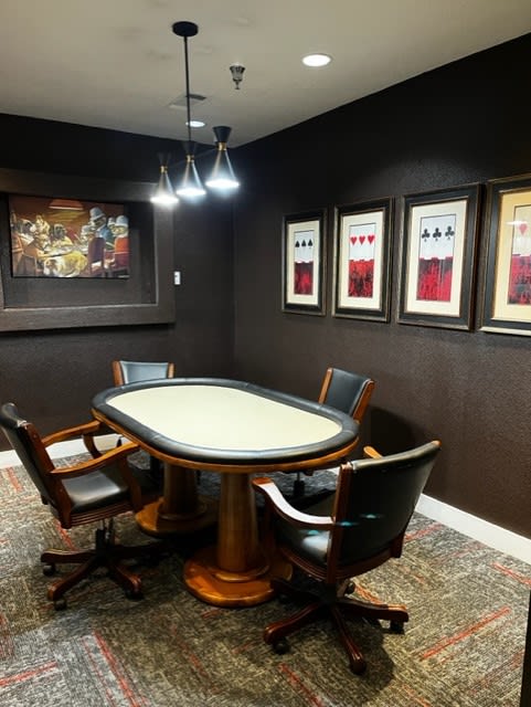 a conference room with a table and chairs At Metropolitan Apartments in Little Rock, AR