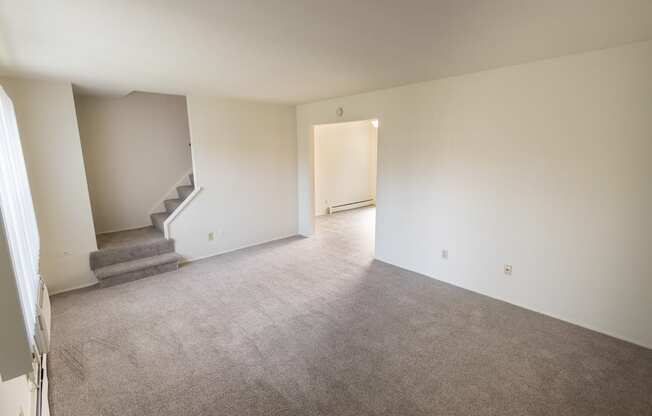 This is a photo of the living room in the 1004 square foot, 2 bedroom, 1.5 bath townhome floor plan at Lake of the Woods Apartments in Cincinnati, OH.