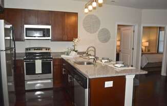 A kitchen with a stove top oven and a microwave.