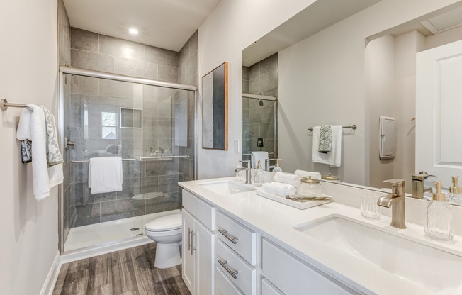 Escape to a haven of relaxation in the bathrooms at Amavi Mooresville, featuring spa-like soaking tubs.