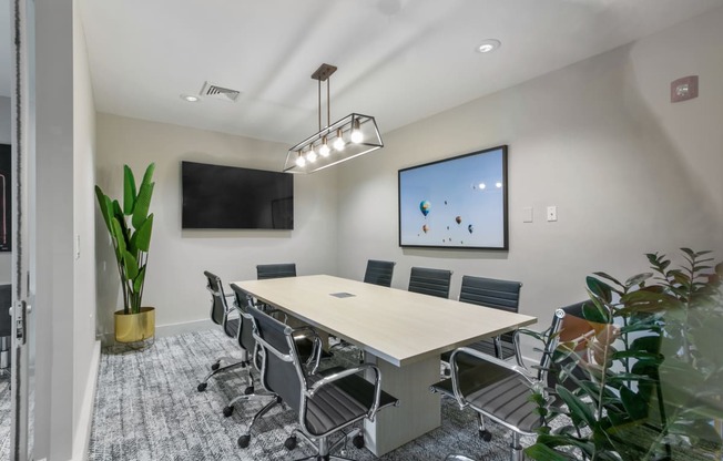 a conference room with a table and chairs