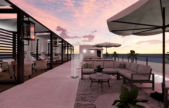 A modern outdoor seating area with a view of the water.