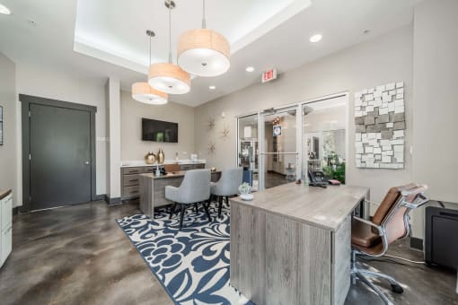 a lobby with a reception area and a desk with chairs