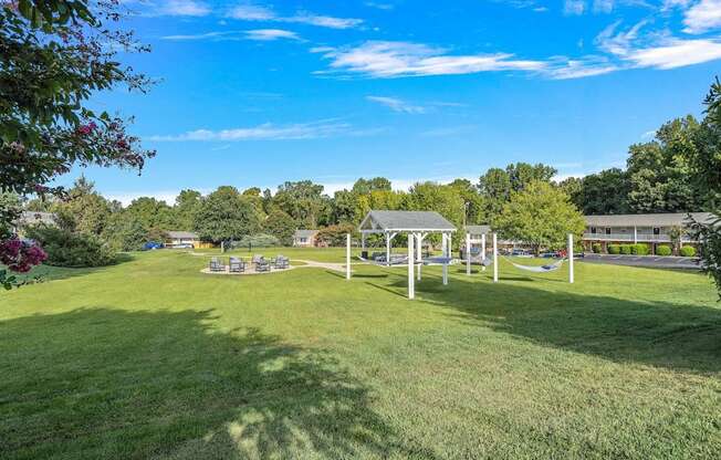 a park with a playground and a swing set