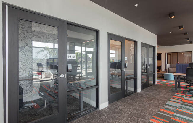 a view of the lobby of a building with glass doors