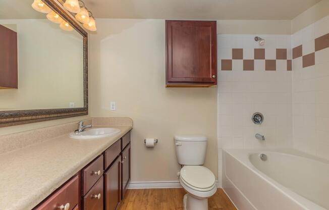 a room with a sink and a mirror