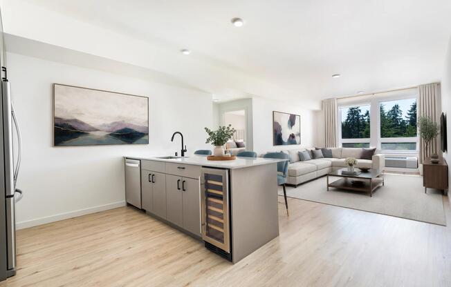 Premium homes feature oversized kitchen islands, built-in wine refrigerators, quartz countertops, and spacious open-concept layouts designed for elevated living and entertaining.