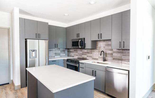 Modera Chandler features modern kitchens with multiple finish options, sleek cabinetry, and a functional island for everyday living.