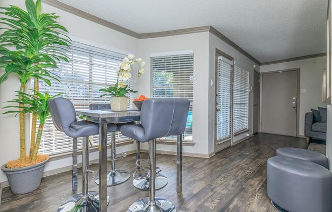 furnished dining room with wooden floors