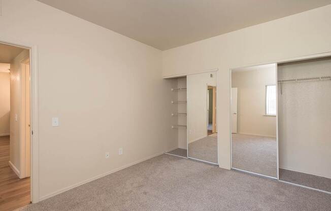 A large empty room with a carpeted floor and white walls at Sunset Summit, Rocklin, CA, 95765